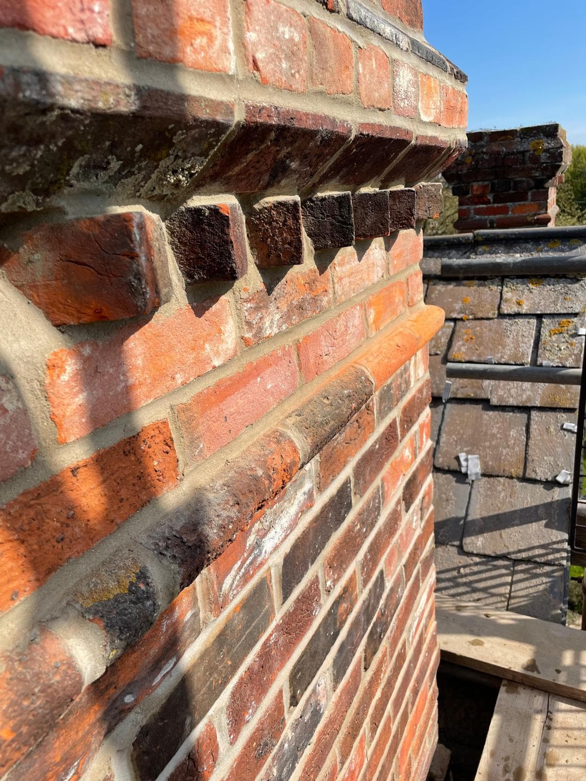 Brick boundary wall with clean coping stones