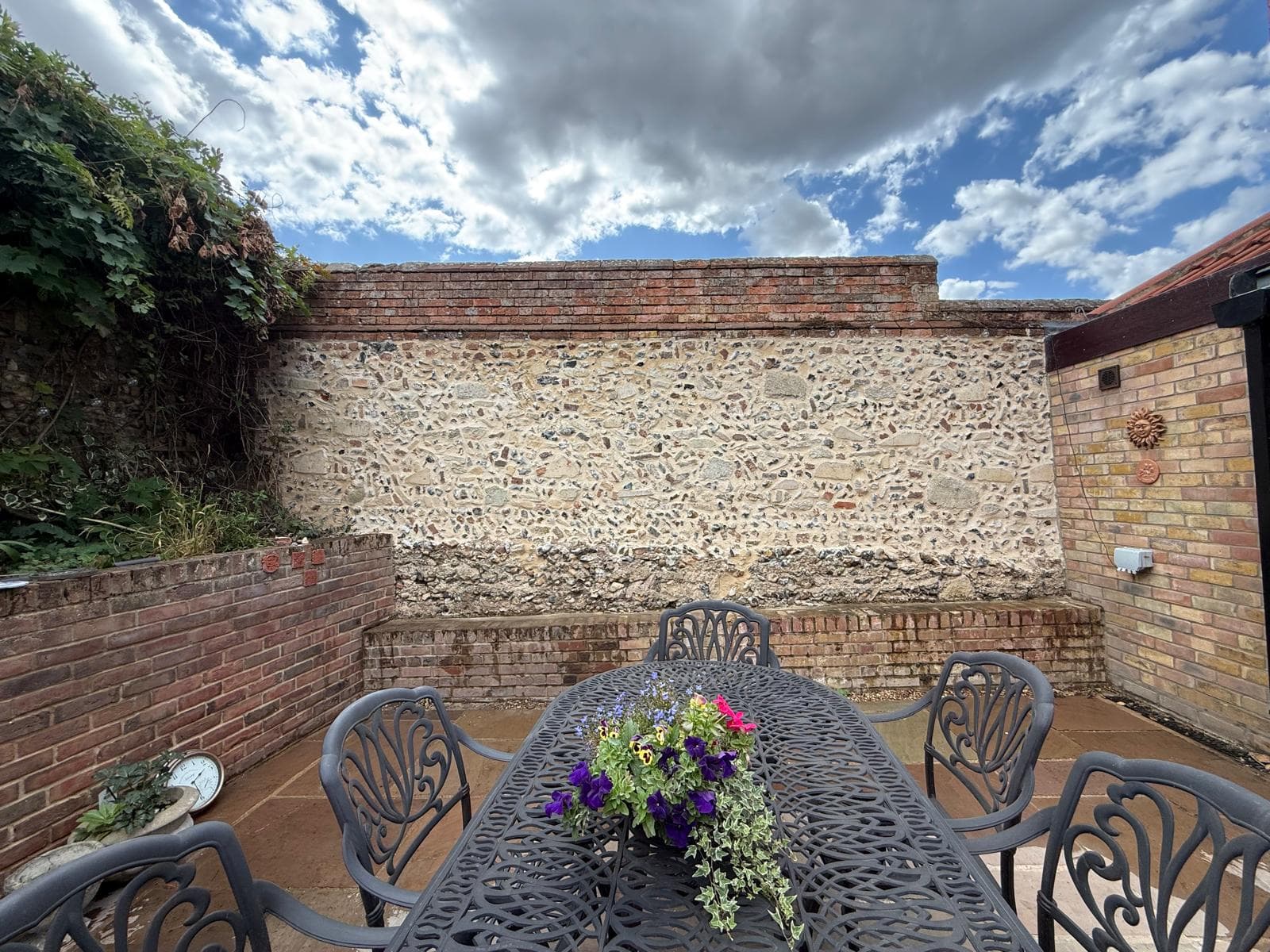 Flintwork integrated into a landscaped garden